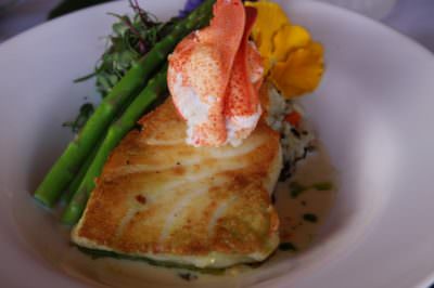 MustDo.com | Pan seared fish topped with lobster from South Beach Grille Ft. Myers Beach, Florida