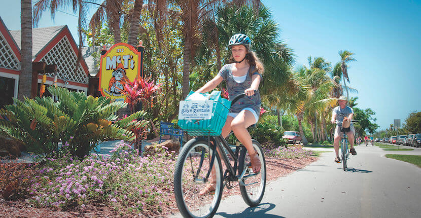 MustDo.com | Biking along Periwinkle Way on Sanibel Island, Florida, USA. Bike rental, family fun activities on Sanibel. Photo by Debi Pittman Wilkey