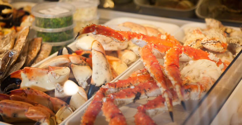 MustDo.com | King and stone crab legs at Captain & Krewe Seafood Market and Raw Bar downtown Naples, Florida offer lunch, dinner, and Happy Hour served in a friendly atmosphere. Photo by Mary Carol Fitzgerald.