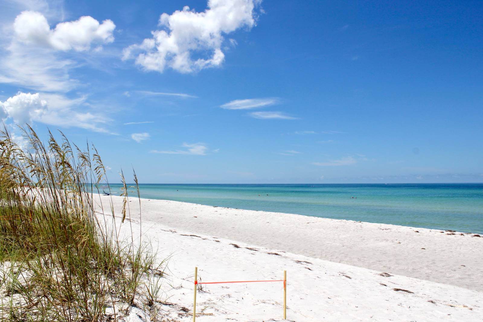 White sand beach and blue waters of the Gulf of Mexico off the coast of Southwest Florida USA. Photo by Nita Ettinger | Must Do Visitor Guides, MustDo.com