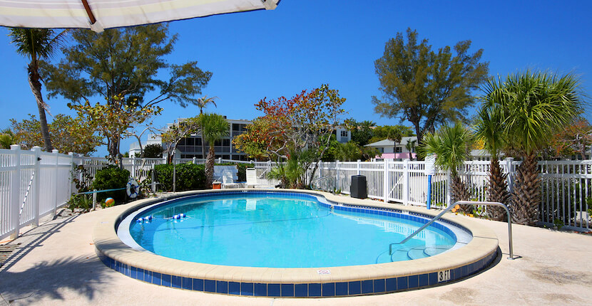 Swimming pool at the Island Inn Historic Luxury Beachfront Resort on Sanibel Island, Florida. Must Do Visitor Guides, MustDo.com