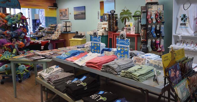Sunshine & Sand Hidden Treasures is a Siesta Key shop offering beach and coastal themed souvenirs, gifts, home decor, artwork, jewelry, t-shirts, hats, and more including 