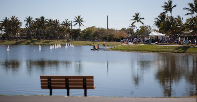 Mackle Park on Marco Island, Florida features paved walkways along the edge of a small lake, community center, dog park, covered basketball court, volleyball court, soccer field, children’s playground and splash park.