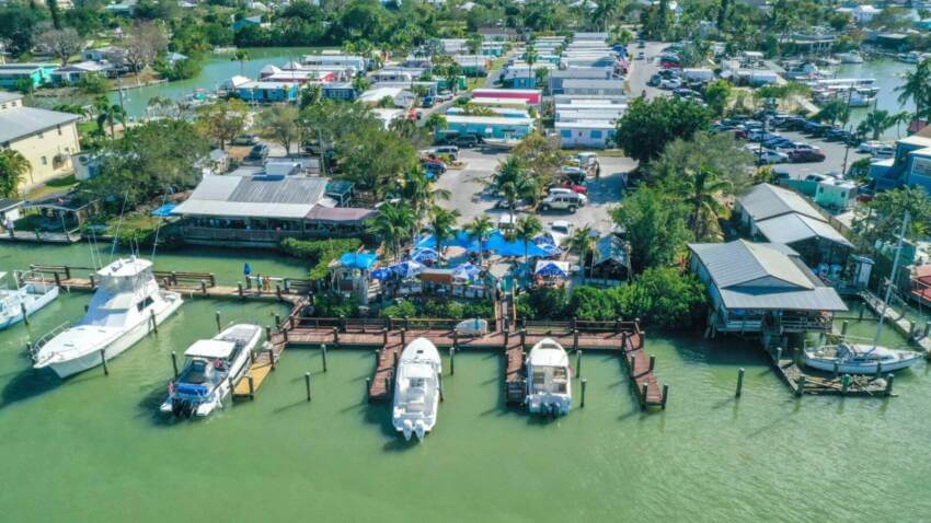 Aerial view of the Crabby Lady restaurant with boat docks in Goodland, Florida. 