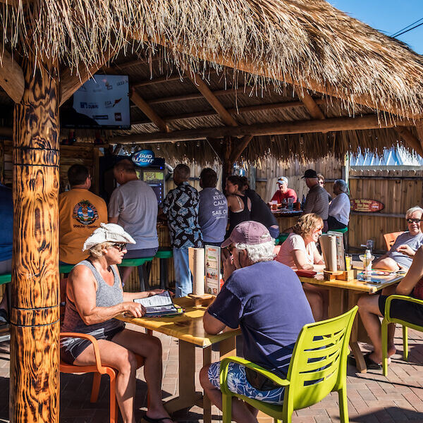 Live music, Happy Hour, and late night dining at Captain Curt’s Sniki Tiki bar in Siesta Key, a tropical-themed bar with outdoor patio located near the beach.