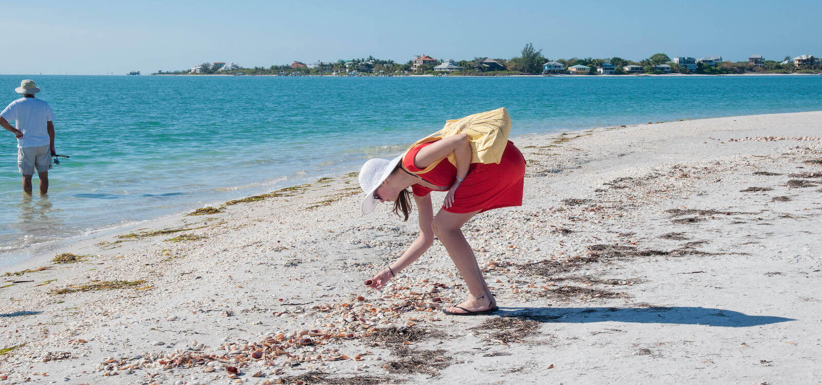 Woman bent over picking up a shell, shelling at Cayo Costa beach Fort Myers, Florida. USA. Photo by Debi Pittman Wilkey