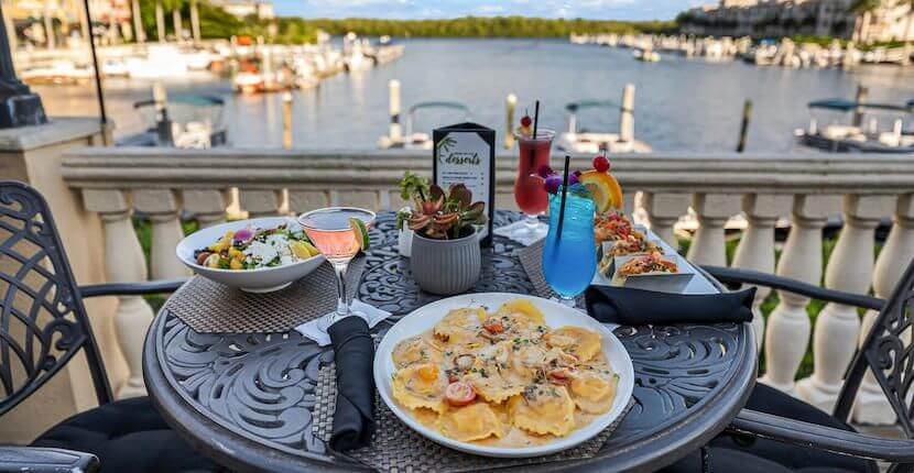 Bambu Tropical Bar & Grille located downtown Naples at Bayfront Inn 5th Avenue and offers casual dining overlooking Naples Bay and the marina with indoor and covered, open-air dining on the bayside terrace.
