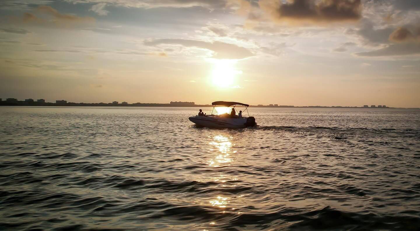 Sarasota Bay Explorers private boat charter with sunset.