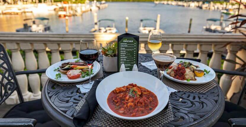 Bambu Tropical Bar & Grille located downtown Naples at Bayfront Inn 5th Avenue and offers casual dining overlooking Naples Bay and the marina with indoor and covered, open-air dining on the bayside terrace.