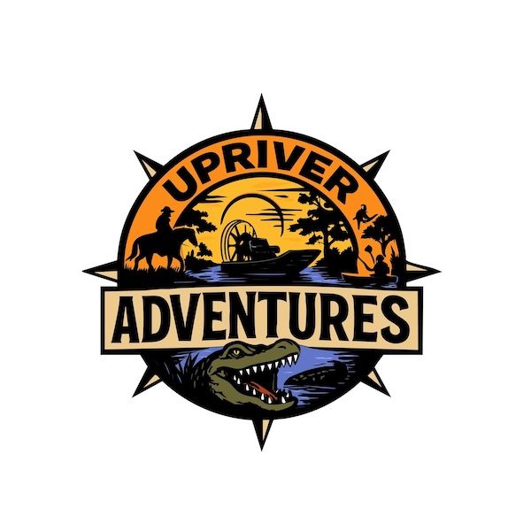 Adventure logo for Up River Adventures featuring a compass rose, sunset river scene, and a crocodile head with a boat, riders, and paddlers silhouettes.